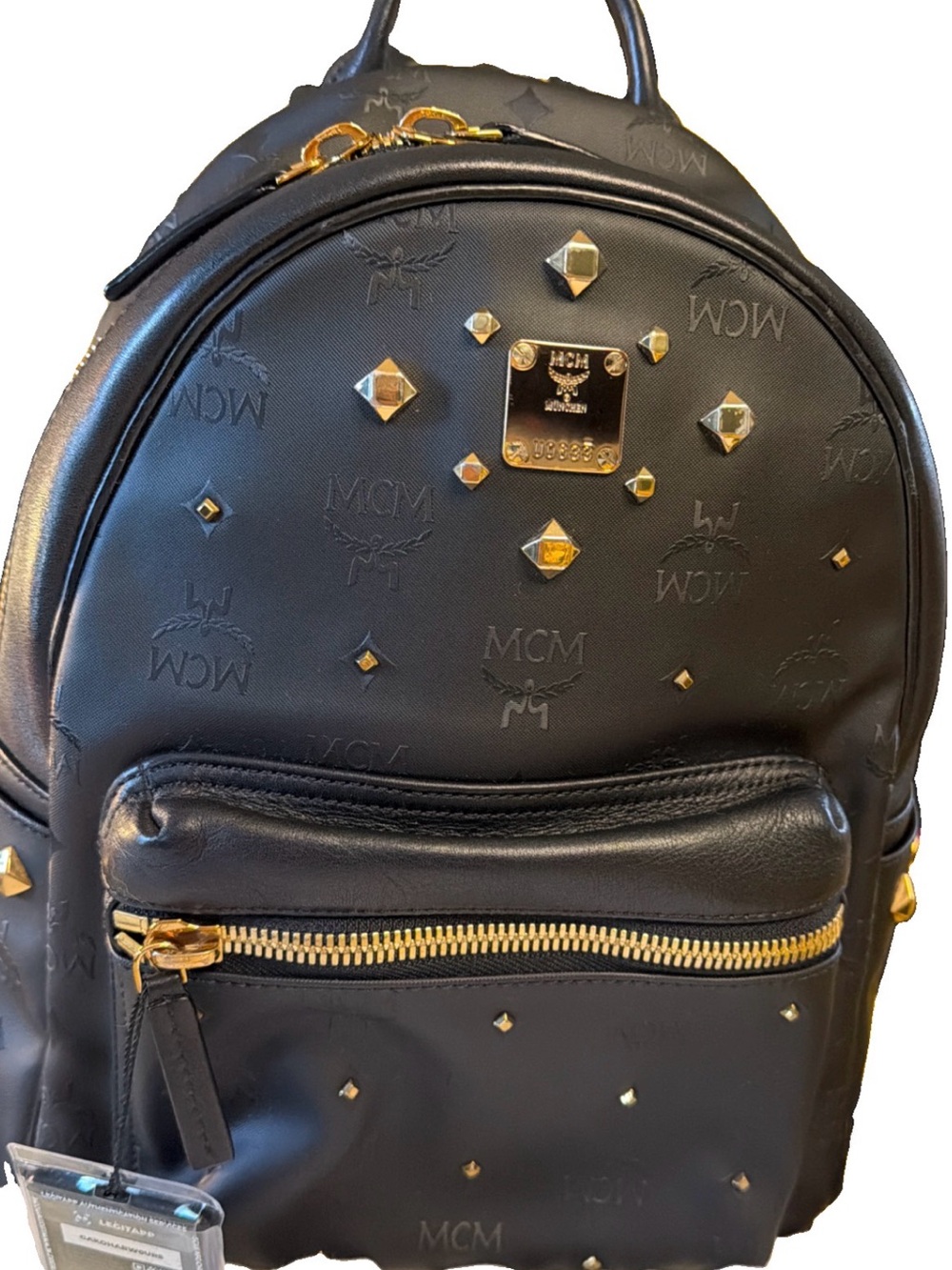 MCM Black Embossed Leather Backpack with Gold Studs